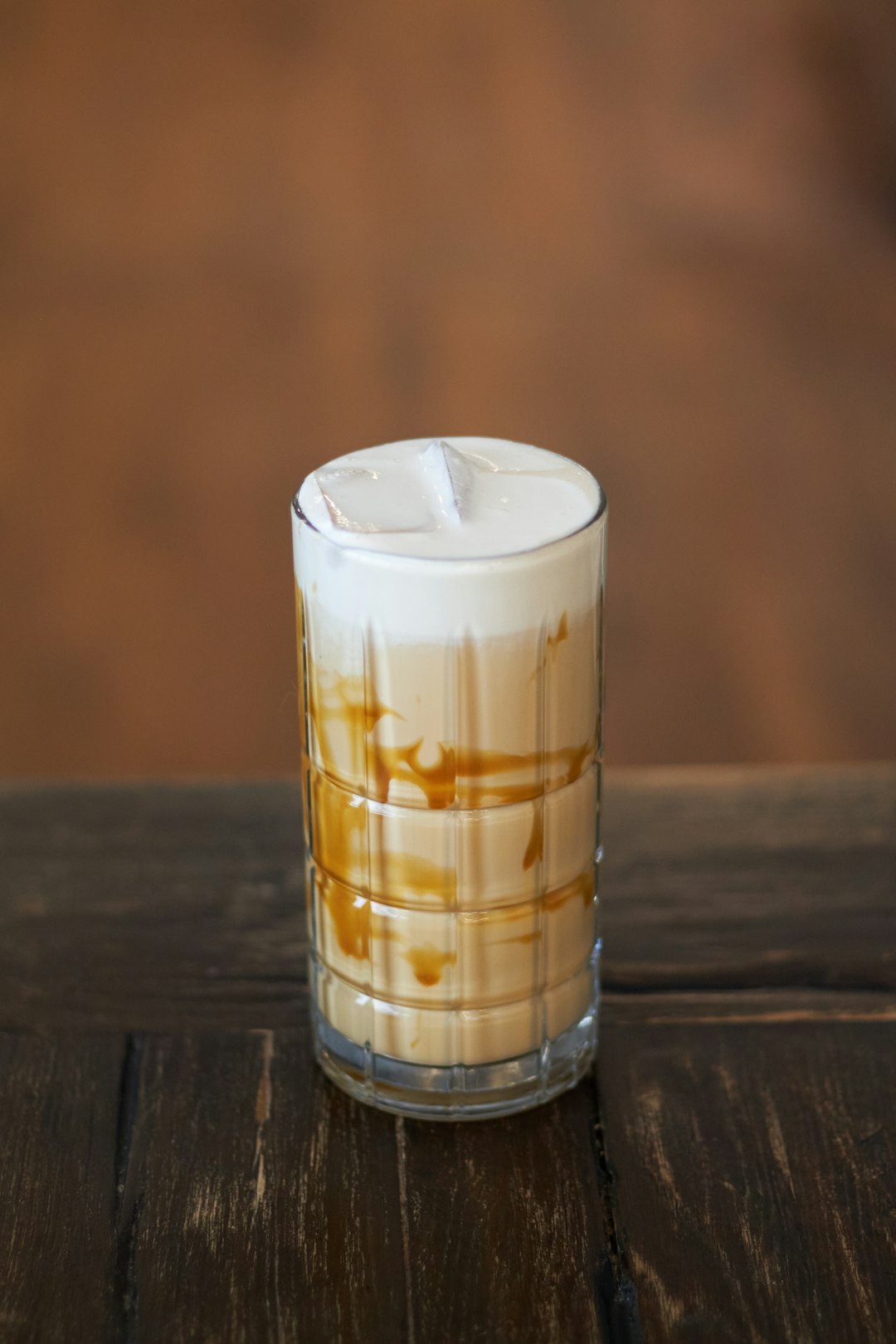 Iced Caramel latte with cold foam on top